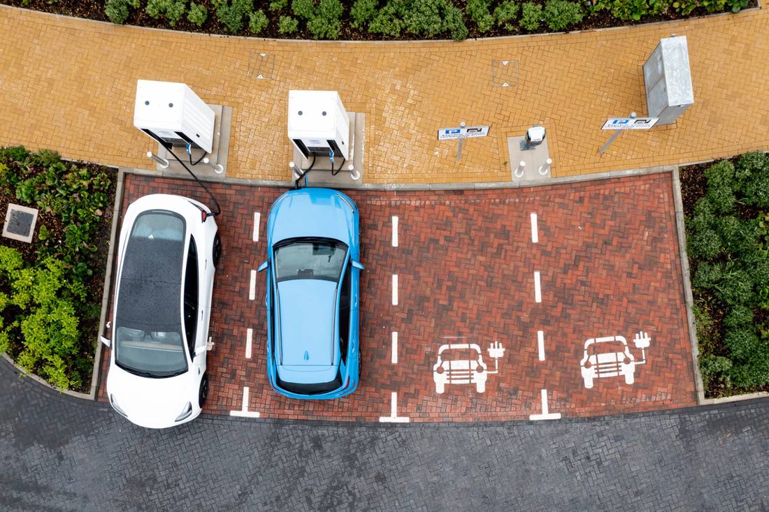 Two electric cars parking at charging station